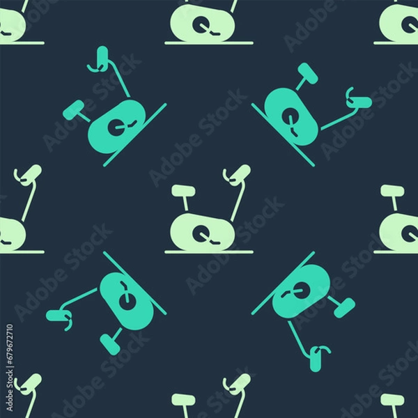 Fototapeta Green and beige Stationary bicycle icon isolated seamless pattern on blue background. Exercise bike. Vector