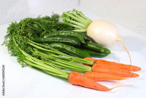 Fototapeta にんじんの収穫　畑で掘り出した新鮮人参