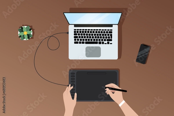 Fototapeta Workflow of vector illustrator or designer at workplace with laptop and graphics tablet, top view of workplace, graphics tablet, phone and dried flowers, female hands drawing on graphics tablet