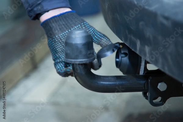 Fototapeta Tow bar for the car. Installing the towbar on the car.