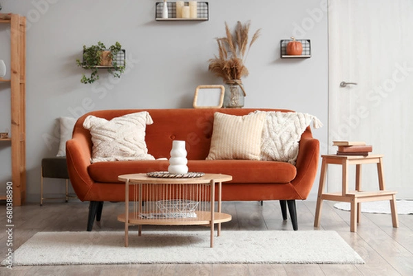 Fototapeta Interior of modern living room with brown sofa and wooden coffee table