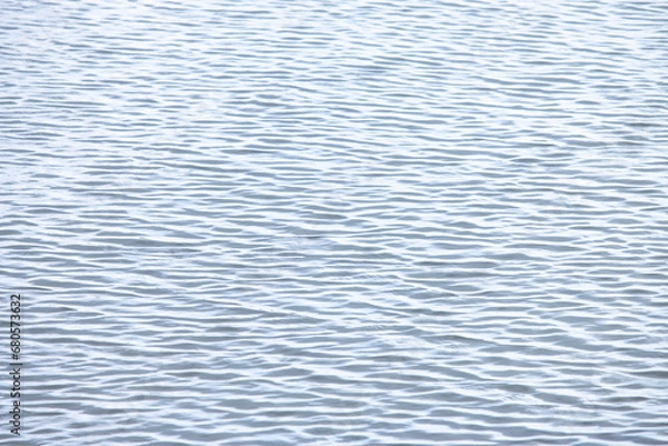 Fototapeta The background of the sea surface has many small waves.