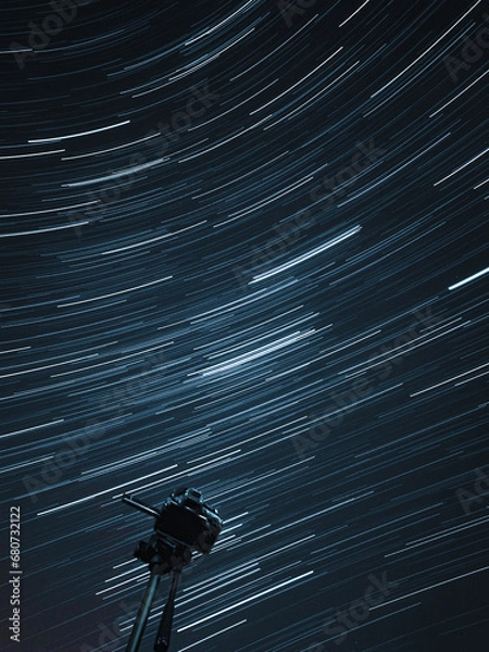 Obraz The rotation of the earth and the stars in the night sky 