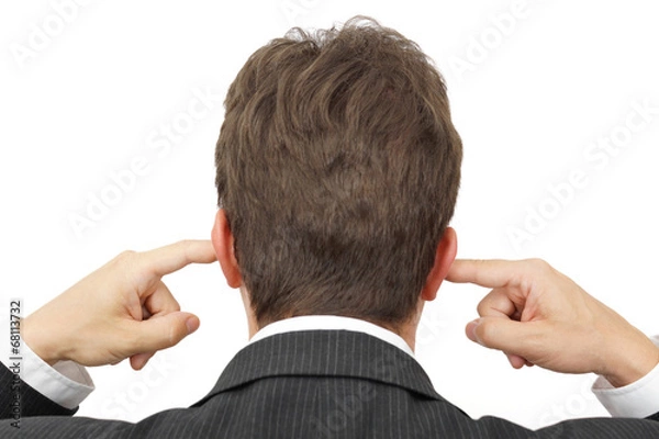 Fototapeta businessman blocking his ears with fingers . .deaf manager conce