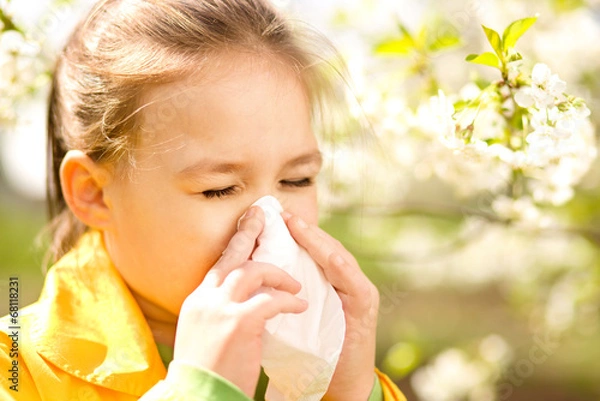 Obraz Little girl is blowing her nose