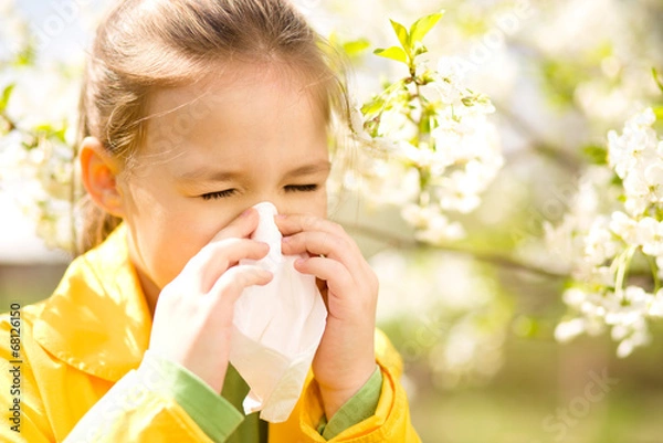 Obraz Little girl is blowing her nose