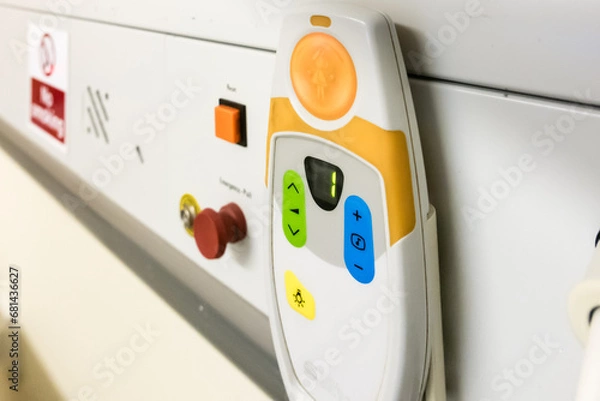 Obraz Bed head unit in a hospital ward showing an emergency red pull call bell and an electrostatic discharge point.