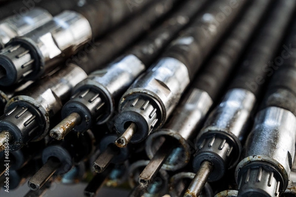 Fototapeta Wire, drive of motor parts, storage of rubber hoses in production.