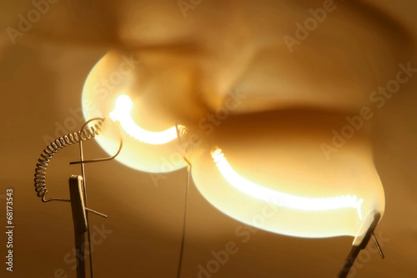 Obraz Close up glowing light bulb thread