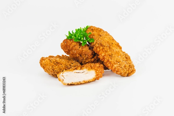 Obraz Breaded Chicken Inner Fillet, Chicken Breaded Raw Meat. Fast cooking.Breaded Chicken nuggets Fillet with salad on a White Background,food at home. Fast homemade food.Chicken breaded schnitzels.