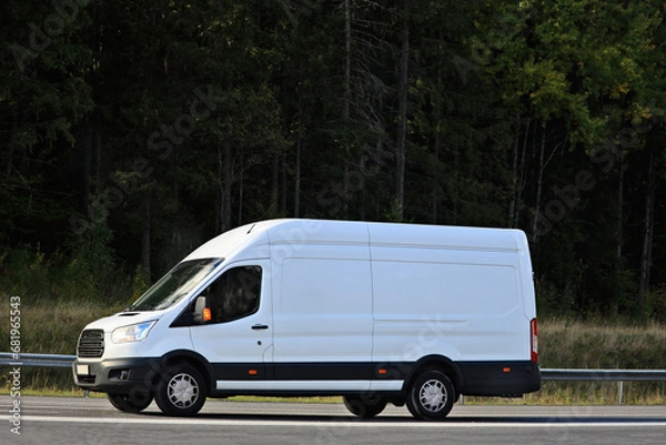 Obraz White Delivery Van at Speed on Highway