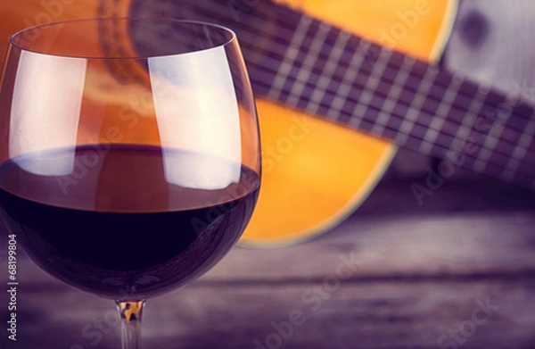Obraz guitar and Wine on a wooden table