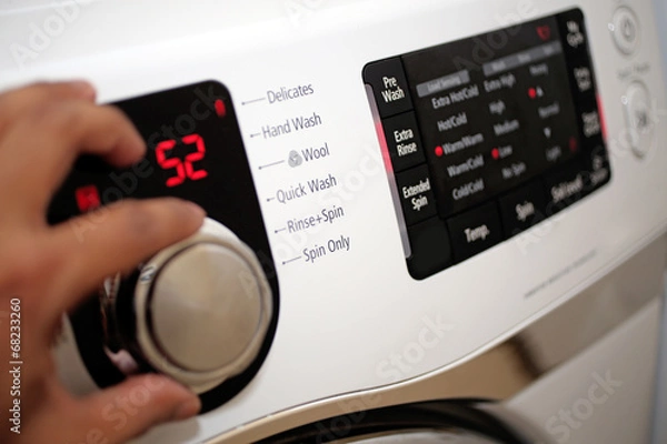 Fototapeta Using washing machine