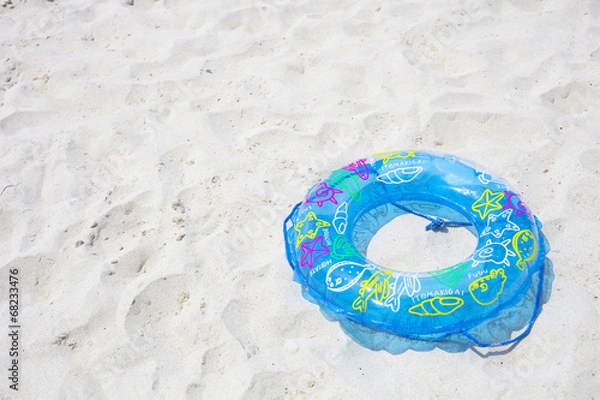 Obraz 砂浜の浮き輪