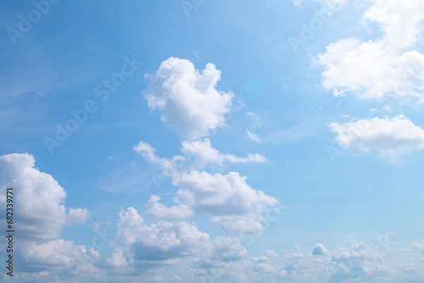 Obraz The sky was beautiful, filled with soft white clouds.