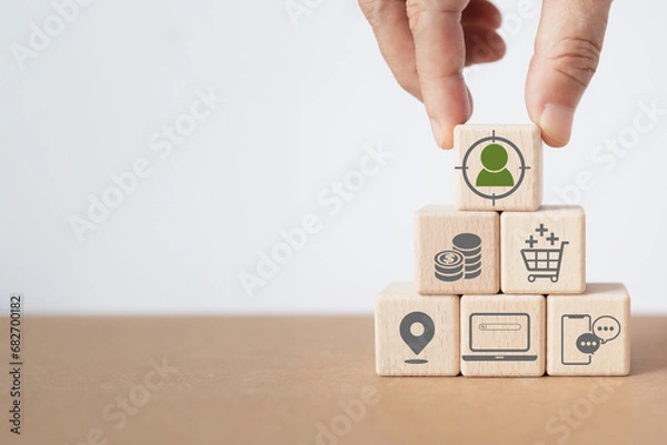Obraz For buyer persona ,target customer concept. Customer psychology profile or characteristics. Personalized marketing. Customer analysis for marketing plan. Hand and wood cubes with buyer persona icons