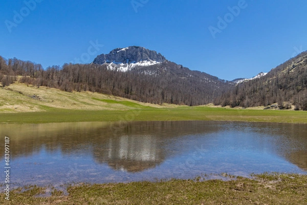 Obraz Mountain landscape against clear blue sky