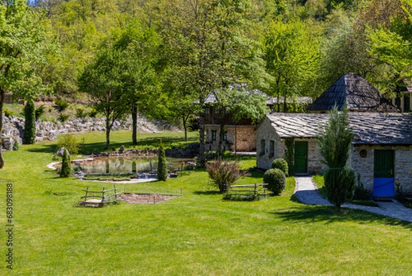 Obraz Cottages surrounded by trees