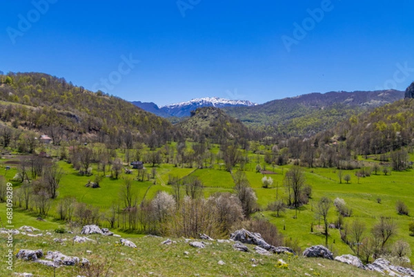 Obraz Mountain valley against clear blue sky