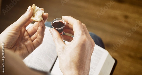 Fototapeta Woman taking communion - bread and wine. Christian faith and practice concept