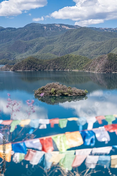 Obraz Buddhist prayer flags fluttering next to Lugu Lake in China