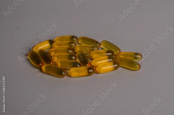 Fototapeta Omega 3 capsules - fish shape. Top view, copy space, high resolution product. Health care concept