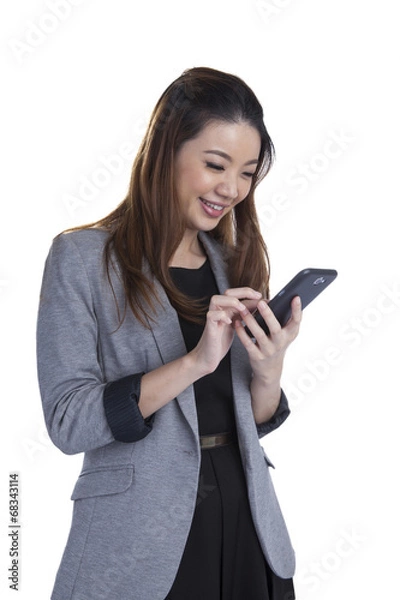 Obraz Cheerful young woman smiling at cell phone message