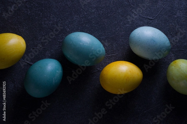 Fototapeta painted easter eggs on a dark background