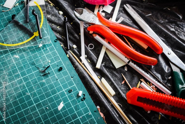 Obraz Creative workplace: Materials for scale model building, model assembly, creative work. Building miniatures and decor. Relaxing at home, making your own little world.
