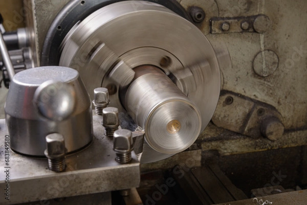 Obraz An old lathe at work. At work.