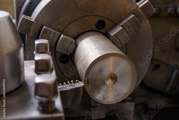 Obraz An old lathe at work. Processing the workpiece with a cutter