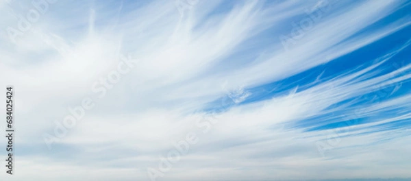 Fototapeta Wispy clouds in a blue sky
