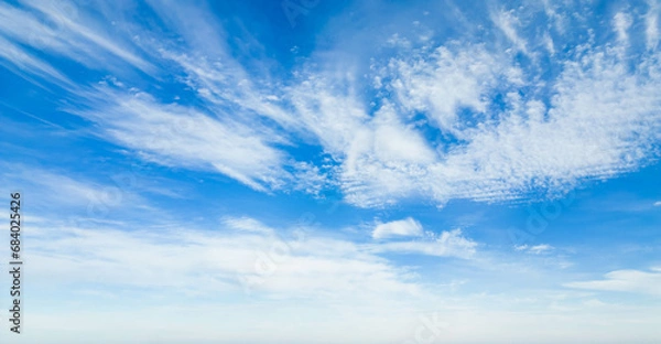 Obraz Wispy clouds in a blue sky