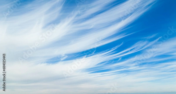 Obraz Wispy clouds in a blue sky