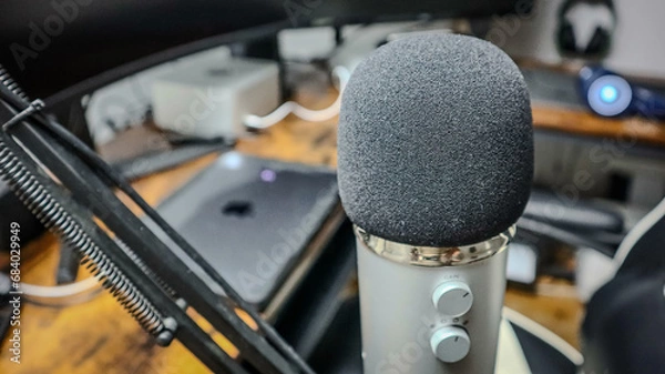 Obraz Microphone in Foreground with Computer Equipment in the Background