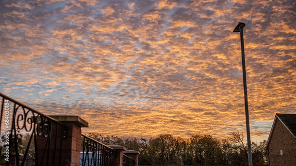 Obraz Morning Sky in Shades of Orange with Gently Rippled Clouds