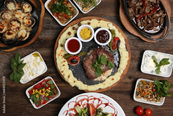 Obraz cooked red meat and various appetizers