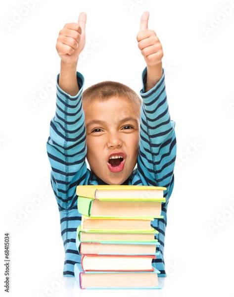Obraz Little boy is reading a book