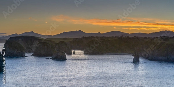 Fototapeta Colorful sunset in unnamed bay on the island of Shikotan, Kuril Islands.