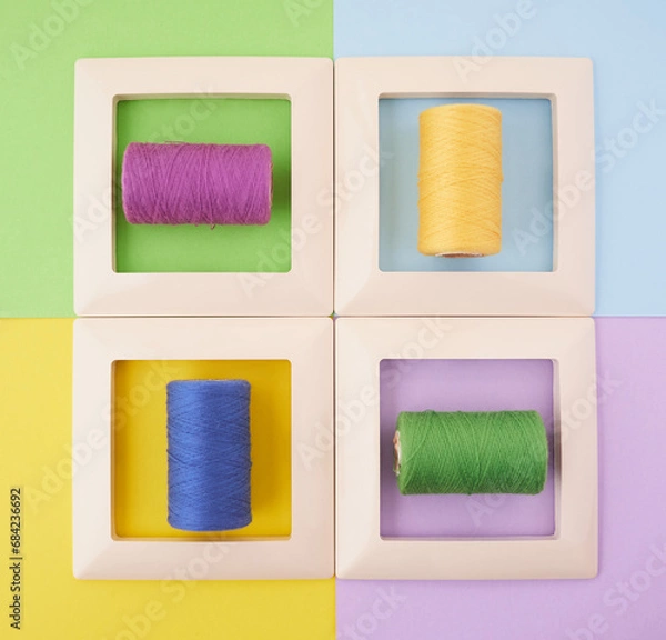 Fototapeta four frames with threads on a multi-colored background