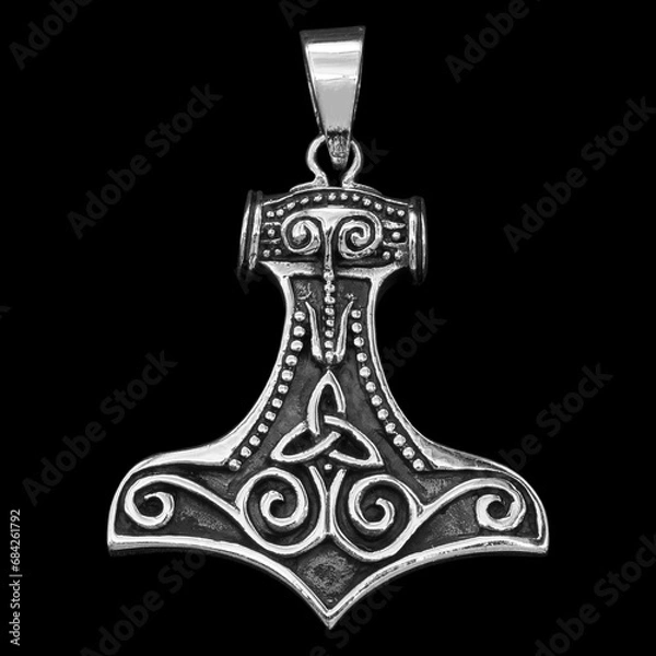 Fototapeta Silver Mjolnir pendant. Peruns ax. Pagan Style. Ancient amulet of Vikings and Slavs. A symbol of strength and power. Protection from evil spirits.