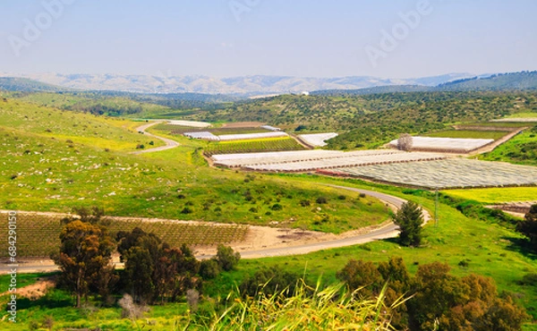 Obraz Landscape with views of meadows, fields, sky and agricultural robots