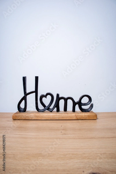 Obraz home, decorative figure with the word home made of black metal and wood on a white background