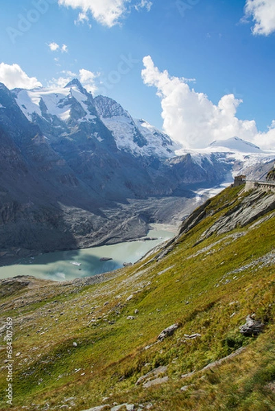 Obraz landscape with glacier in the mountains, blue sky and clouds and a glacier lake