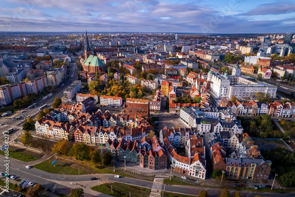 Fototapeta Szczecin from a bird's eye view on a sunny day. View of the city from the Oder River. City buildings, the seaport in Szczecin and its most characteristic places.