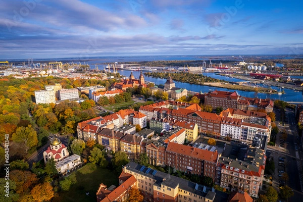 Fototapeta Szczecin from a bird's eye view on a sunny day. View of the city from the Oder River. City buildings, the seaport in Szczecin and its most characteristic places.