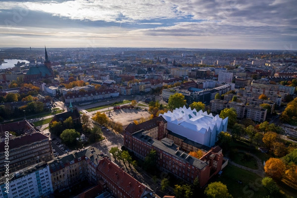 Fototapeta Szczecin from a bird's eye view on a sunny day. View of the city from the Oder River. City buildings, the seaport in Szczecin and its most characteristic places.