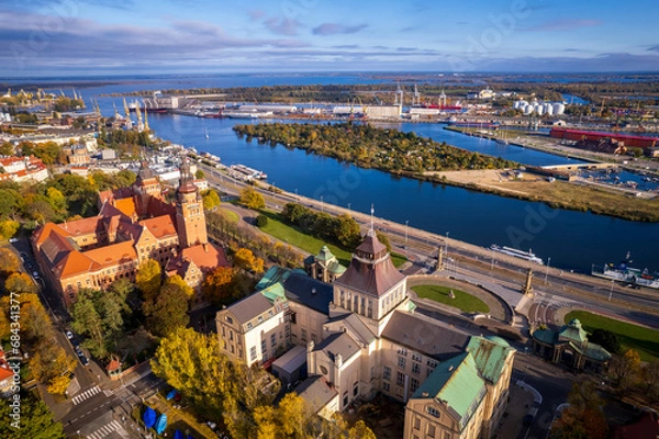 Fototapeta Szczecin from a bird's eye view on a sunny day. View of the city from the Oder River. City buildings, the seaport in Szczecin and its most characteristic places.