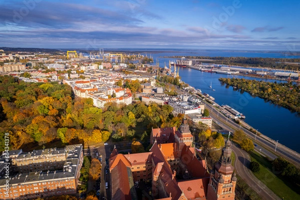 Fototapeta Szczecin from a bird's eye view on a sunny day. View of the city from the Oder River. City buildings, the seaport in Szczecin and its most characteristic places.