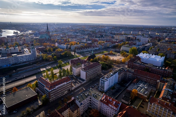 Fototapeta Szczecin from a bird's eye view on a sunny day. View of the city from the Oder River. City buildings, the seaport in Szczecin and its most characteristic places.